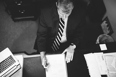 Charleston SC Bankruptcy Lawyer Russ DeMott Sitting at Desk