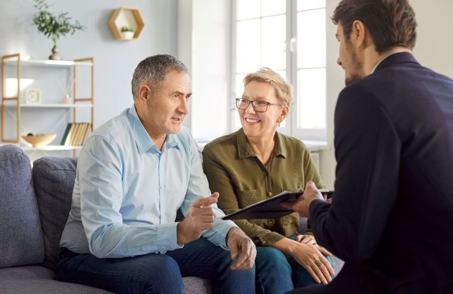 A couple learning with a lawyer how a will can protect their family's future in Hanahan