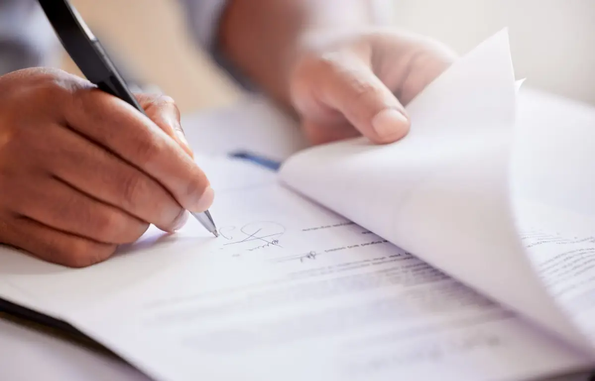Family reviewing Healthcare Power of Attorney, Advance Directive, and HIPAA Authorization documents with an attorney to ensure trusted individuals can make medical decisions and access healthcare information during cognitive decline.